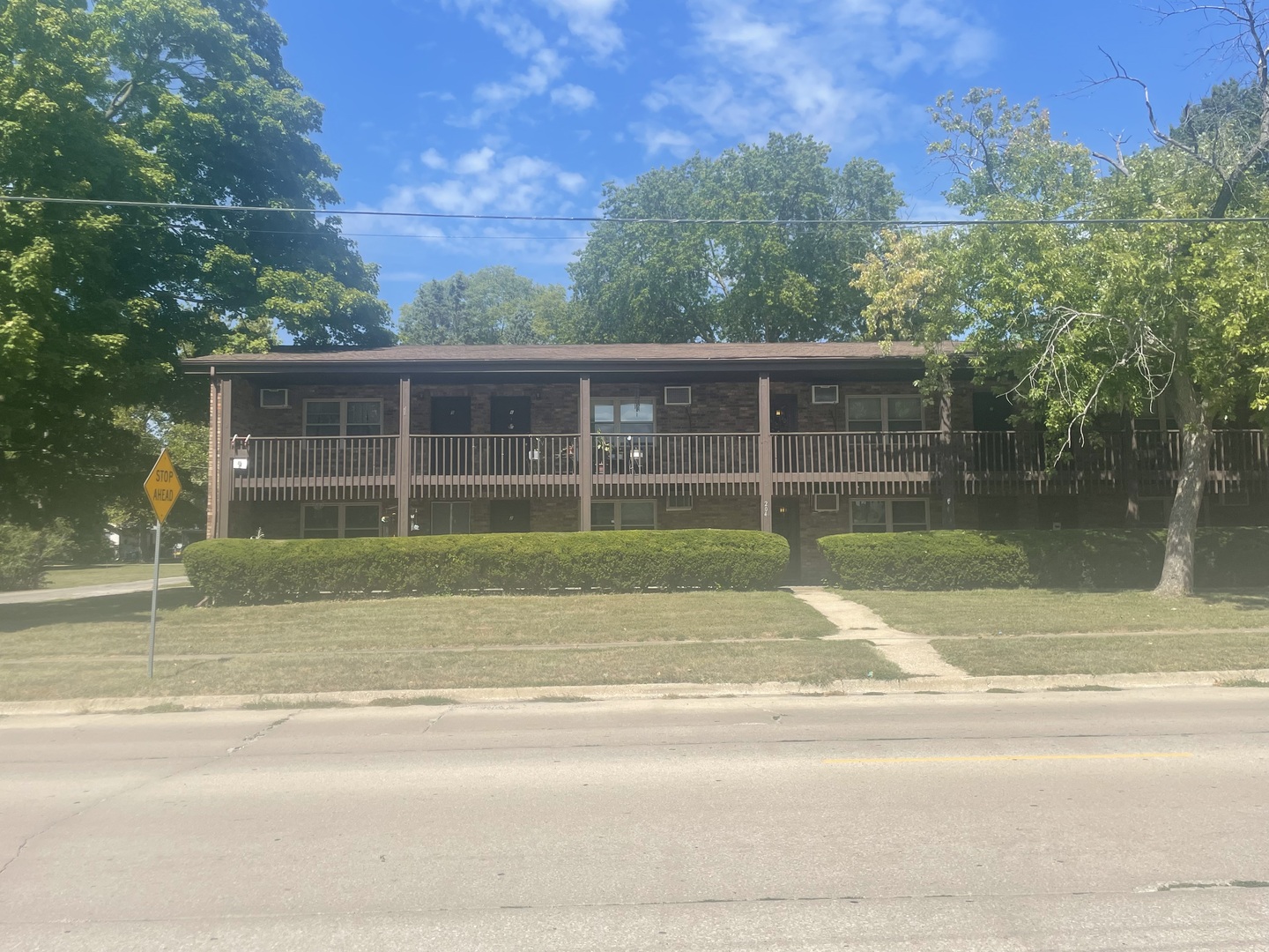 a view of a house with a backyard and a garden