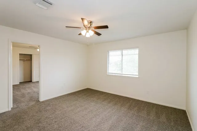 a view of empty room with windows