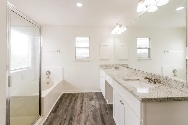 a white bath tub sitting next to a window