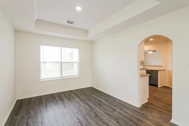 a kitchen with granite countertop a stove and a sink