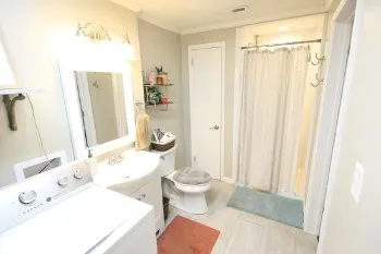 a bathroom with a sink toilet and shower