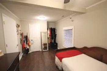 a bedroom with a bed and a window