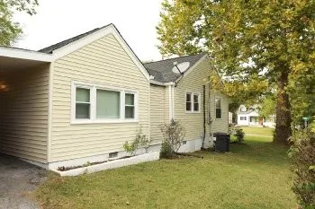 a view of a house with a yard