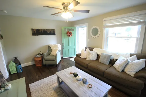 a living room with furniture and a window