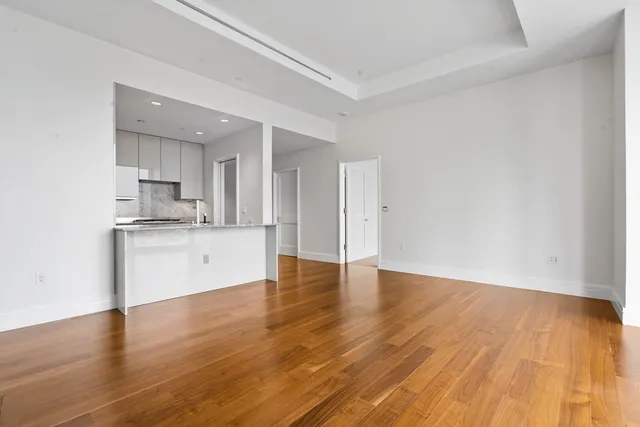 a view of kitchen with wooden floor and window