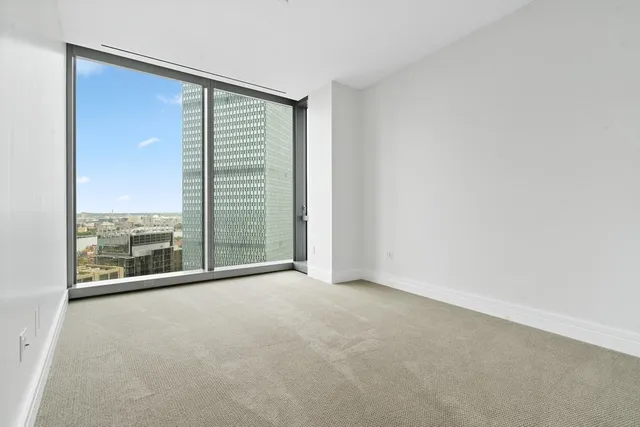 a view of a room with a large window