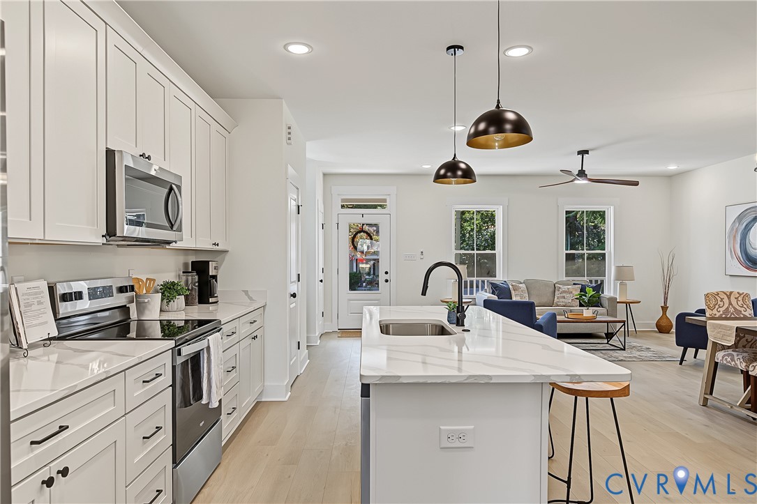 3601.5 Decatur Street Richmond, VA 23224 - Photo 12 of 32 Open-concept living space with light wood-finish f