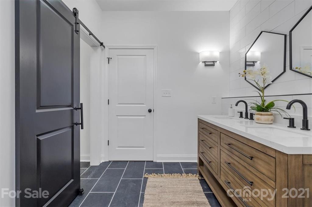 1902 Dunlap Roddey Road Rock Hill, SC 29730 - Photo 20 of 37 a bathroom with a sink a mirror and shower