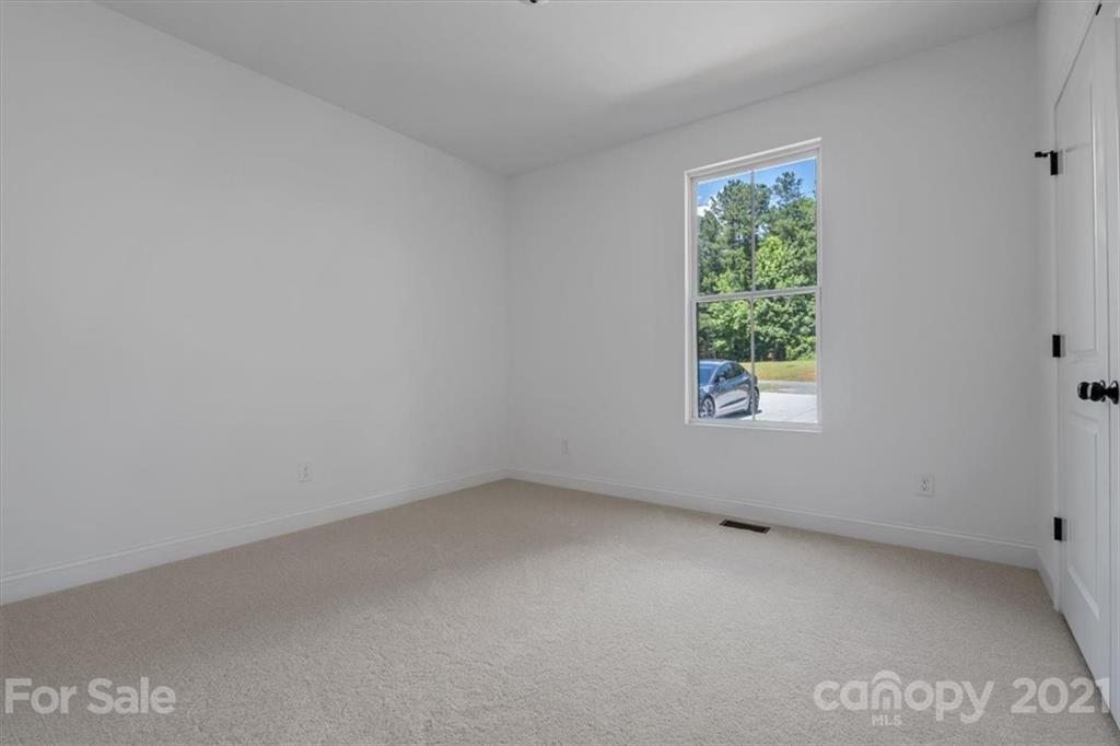 1902 Dunlap Roddey Road Rock Hill, SC 29730 - Photo 22 of 37 an empty room with a window