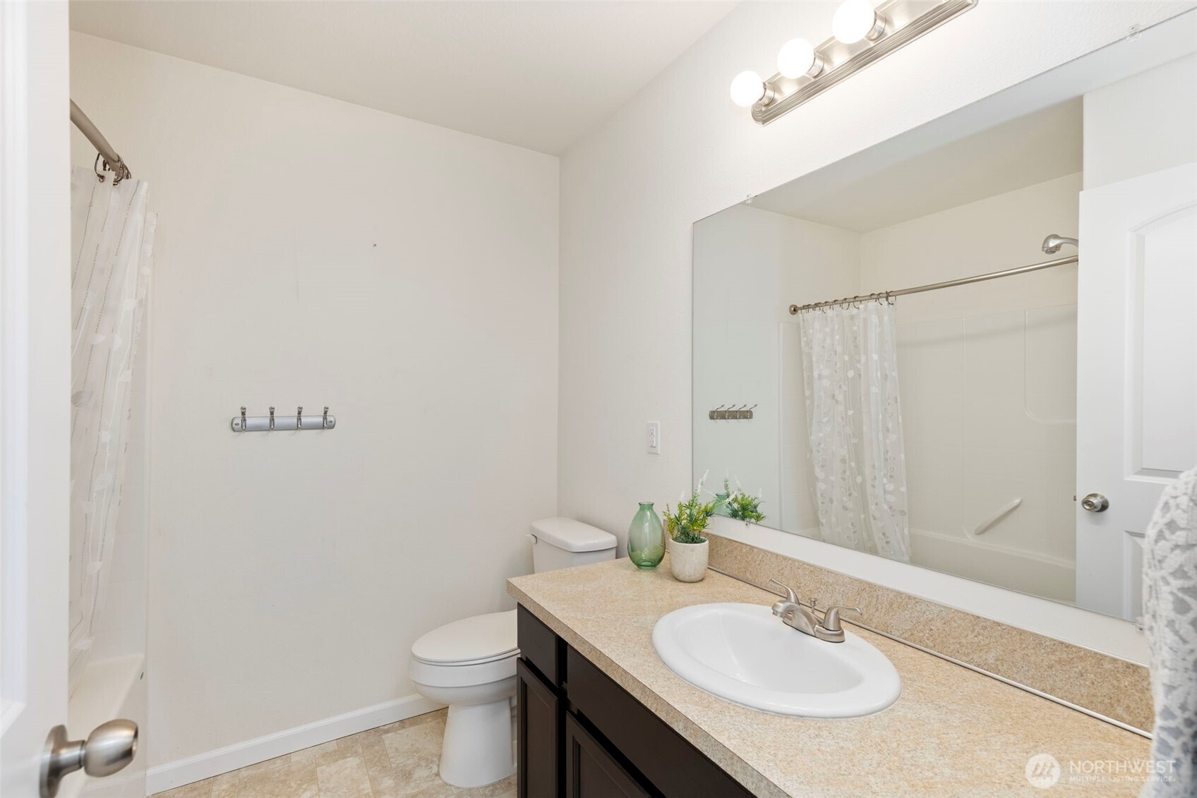 141 Southwest Marcia Way Port Orchard, WA 98366 - Photo 17 of 21 a bathroom with a sink and a mirror