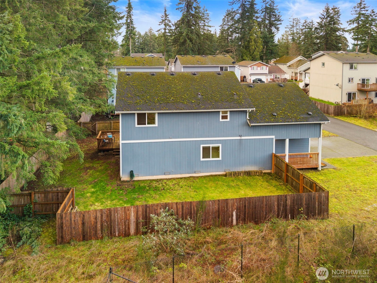141 Southwest Marcia Way Port Orchard, WA 98366 - Photo 21 of 21 a view of a house with pool and a yard