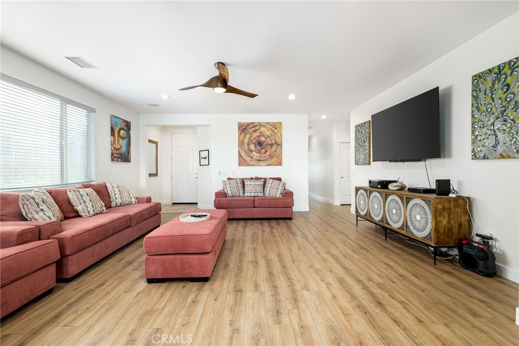 84290 Tramonto Way Indio, CA 92203 - Photo 15 of 45 a living room with furniture and a flat screen tv