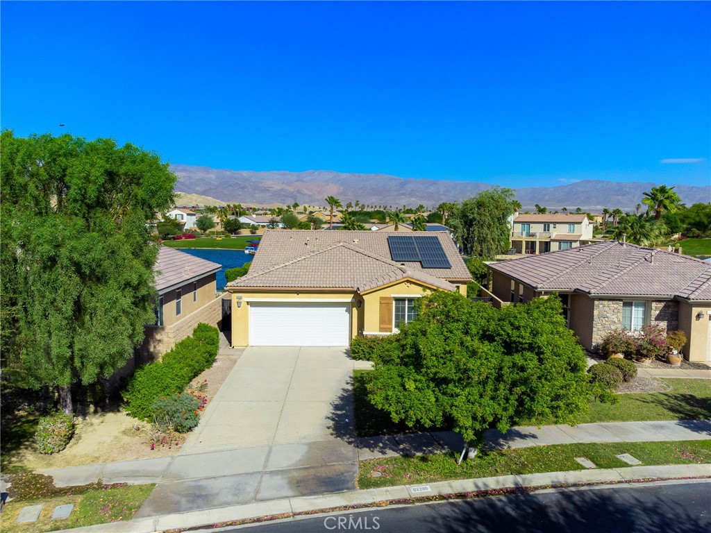 84290 Tramonto Way Indio, CA 92203 - Photo 8 of 45 a aerial view of a house with a yard and lake view