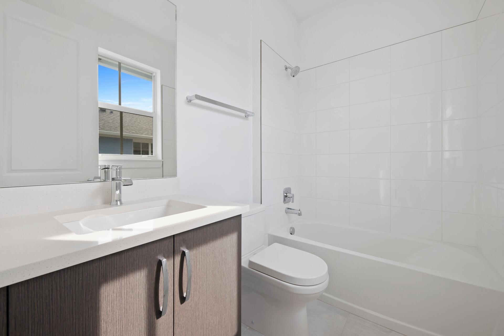 58 Atlantic Grove Way Delray Beach, FL 33444 - Photo 14 of 19 a bathroom with a sink a toilet and shower