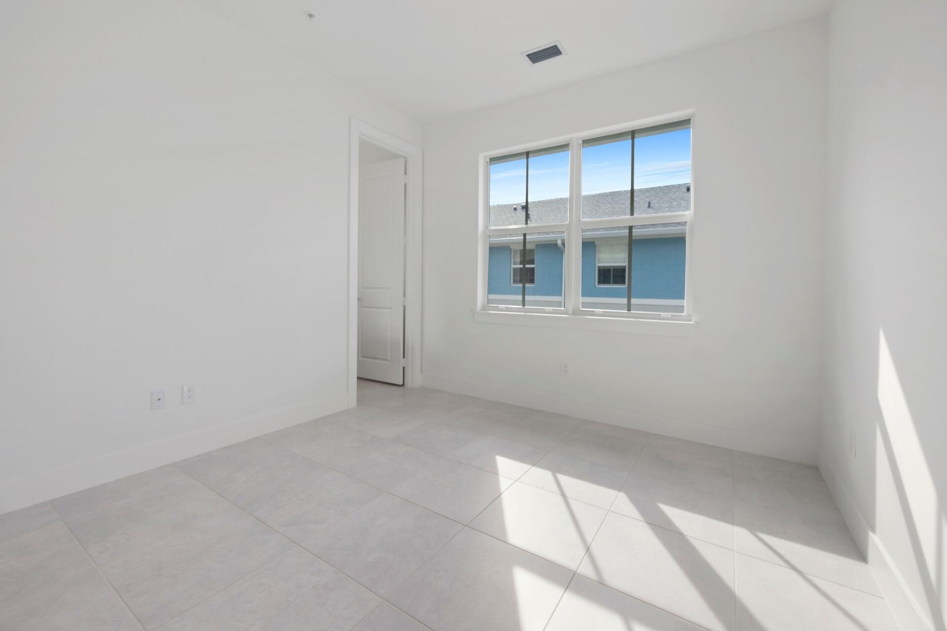 58 Atlantic Grove Way Delray Beach, FL 33444 - Photo 15 of 19 an empty room with a empty space and windows