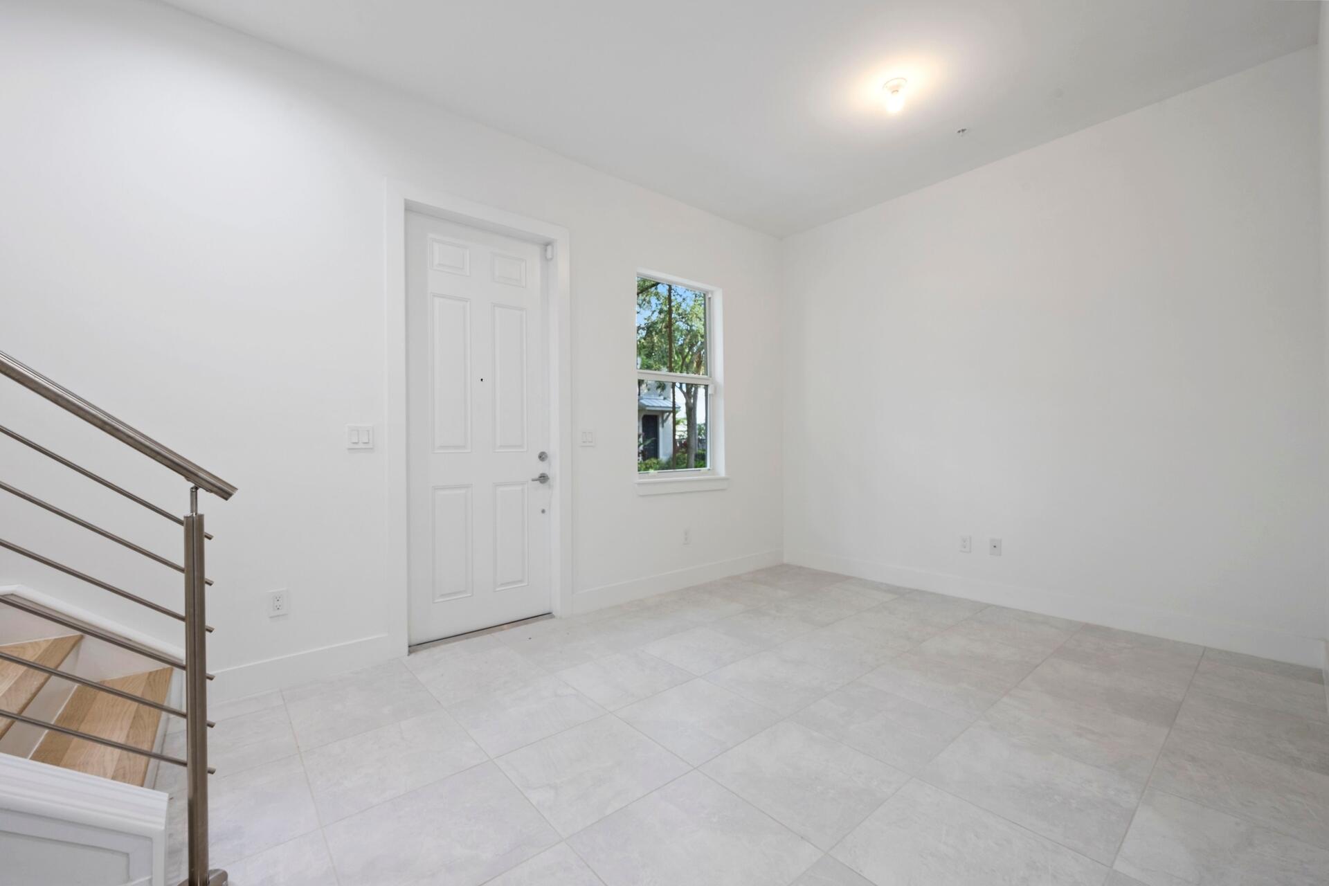 58 Atlantic Grove Way Delray Beach, FL 33444 - Photo 8 of 19 an empty room with windows