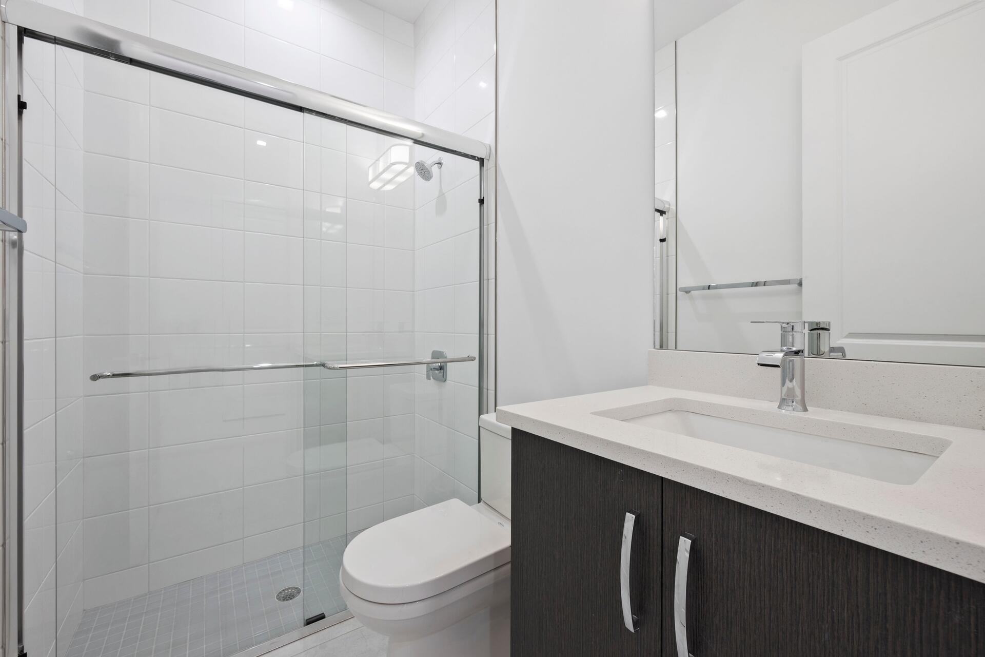 58 Atlantic Grove Way Delray Beach, FL 33444 - Photo 9 of 19 a bathroom with a sink toilet and shower