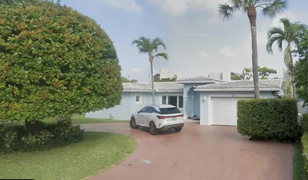 a car parked in front of a house