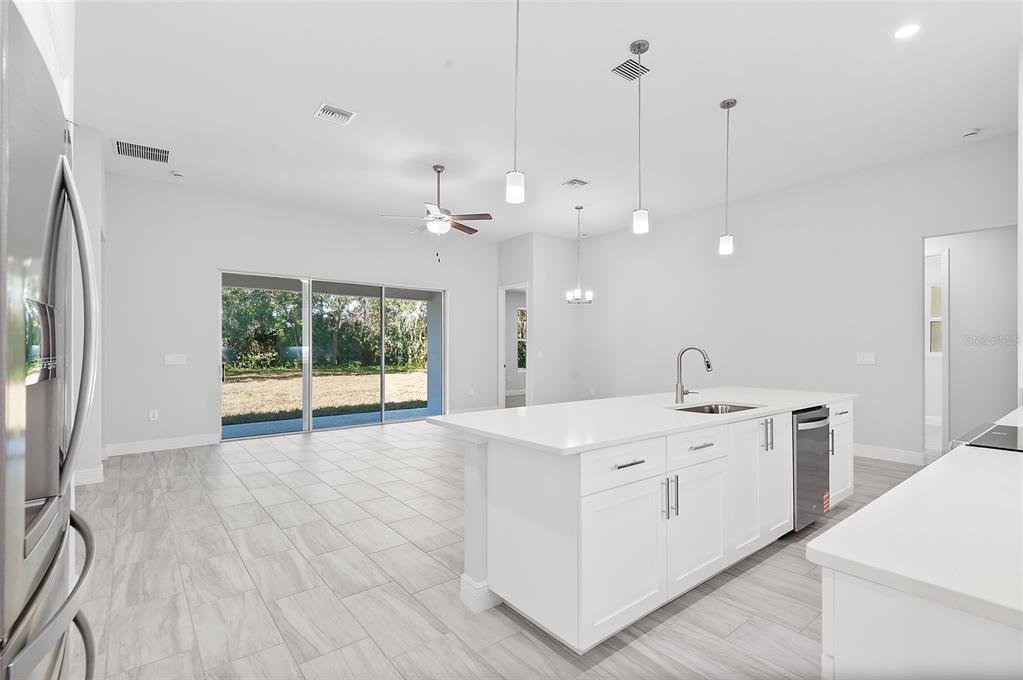 304 North Jungle Road Geneva, FL 32732 - Photo 15 of 49 a view of a kitchen with a sink and wooden floor