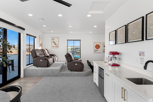 5367 Cyan Lane St. George, UT 84790 - Photo 49 of 49 Entertainment area featuring tiered carpeted seating platforms and a built-in wet bar