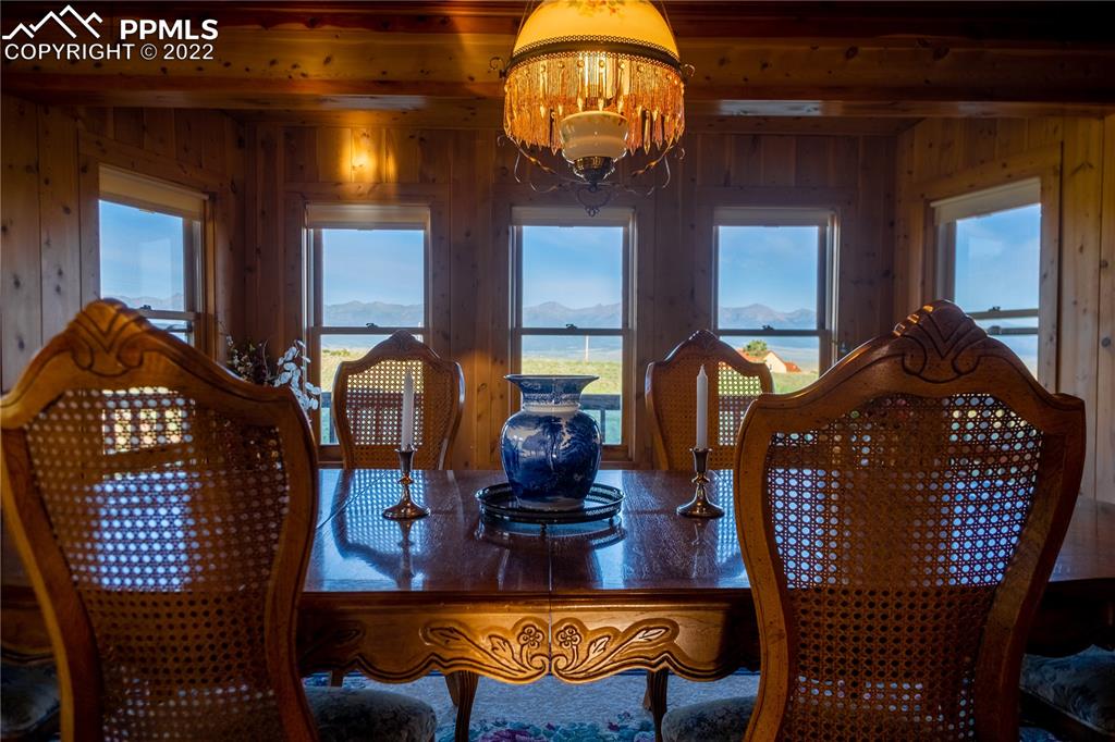 85 Excelsior Road Silver Cliff, CO 81252 - Photo 15 of 27 a view of a dining room with furniture