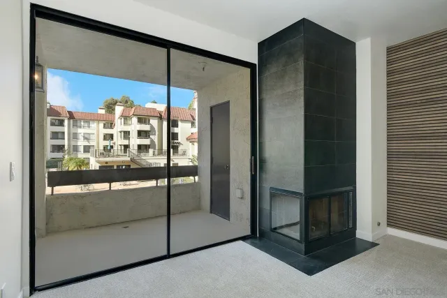 a bathroom with a glass shower door and a sink