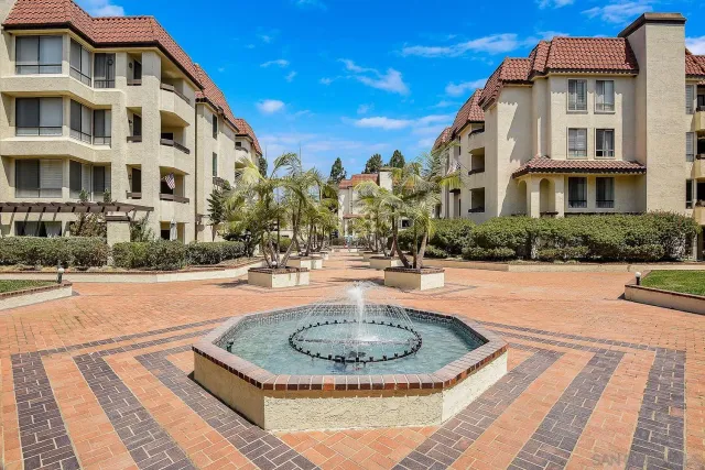 a view of a swimming pool with a garden and plants
