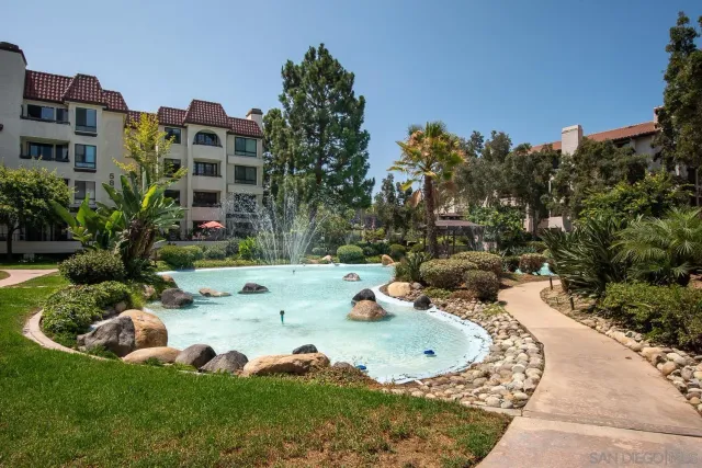aerial view of a tennis ground with large trees