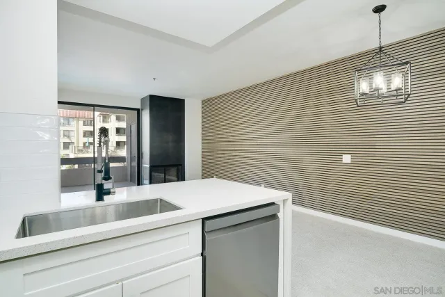 a bathroom with a sink and a large mirror