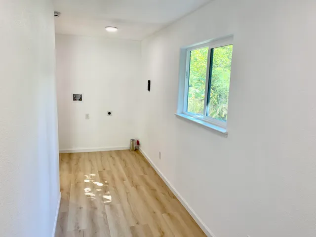 a view of a hallway with a window