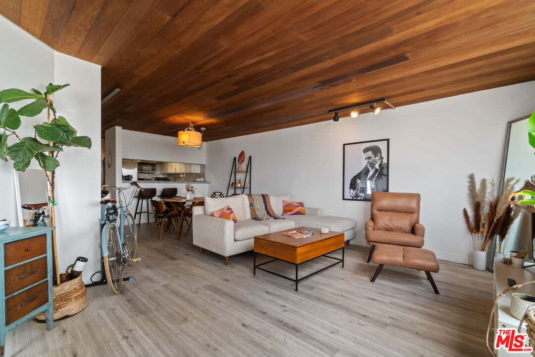 6209 Pacific Avenue, Unit 103 Playa del Rey, CA 90293 - Photo 9 of 40 a living room with furniture and a wooden floor