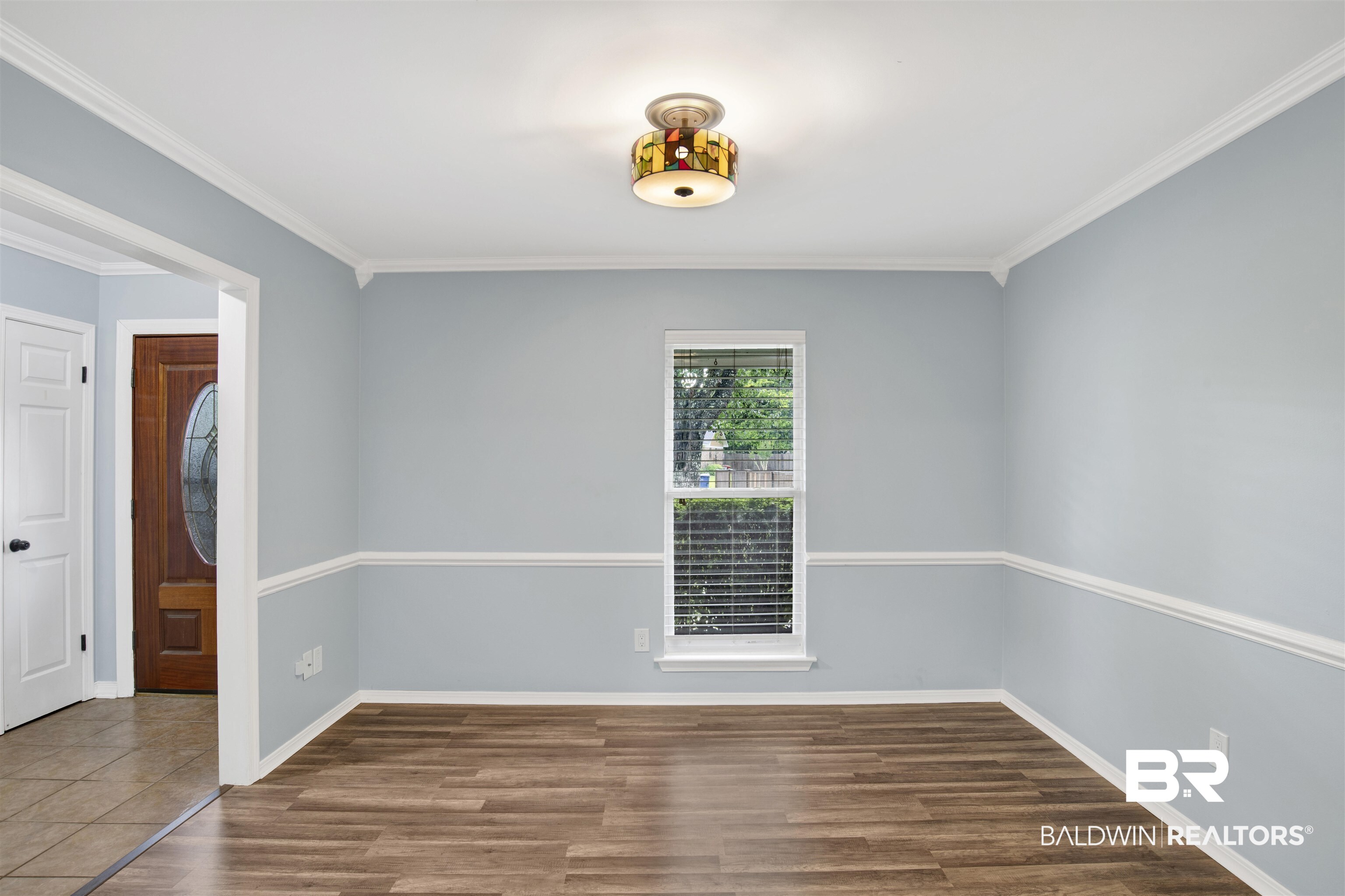 3011 Olde Gate Road Mobile, AL 36695 - Photo 12 of 35 Unfurnished room featuring wood finished floors and ornamental molding