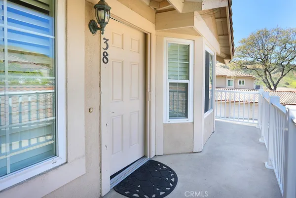 a view of entryway with wooden floor and door