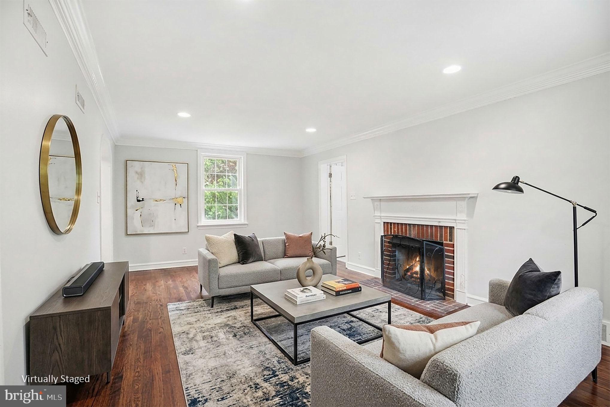 235 Hopkins Road Haddonfield, NJ 08033 - Photo 18 of 47 a living room with furniture a rug a fireplace and a window