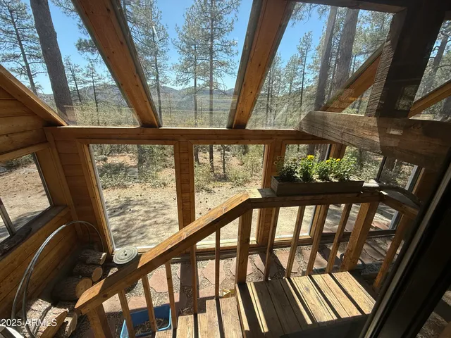 a view of a house with a yard covered in snow