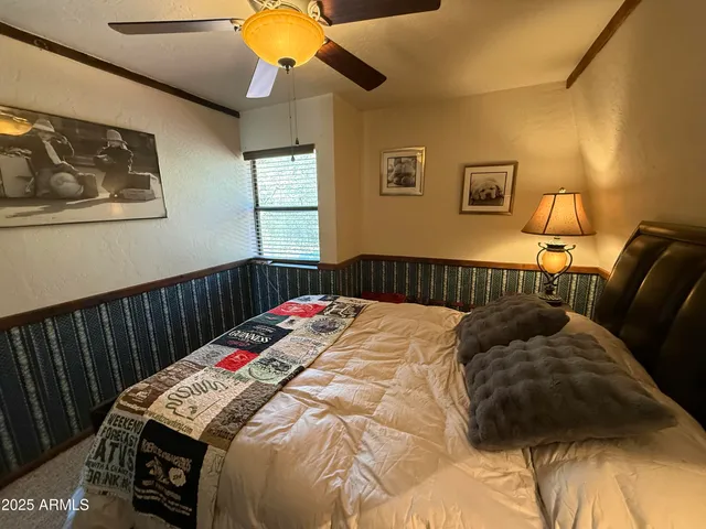 a hallway with wooden floor and furniture