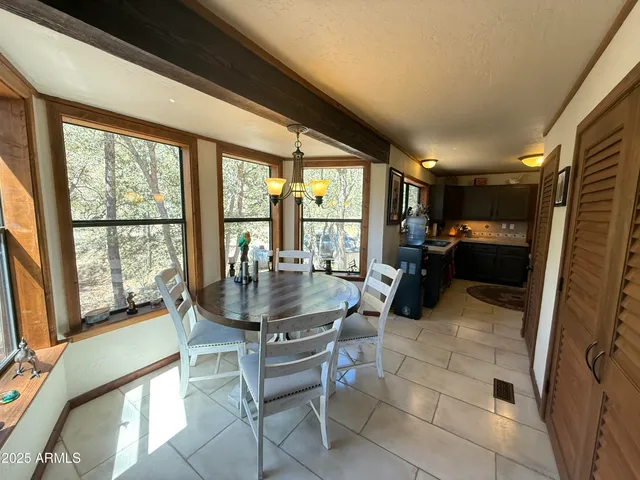 a kitchen with stainless steel appliances a stove microwave and refrigerator