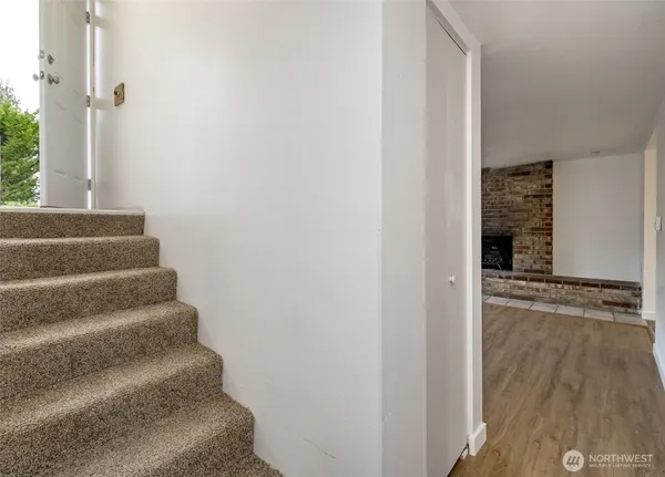 a view of entryway with wooden floor