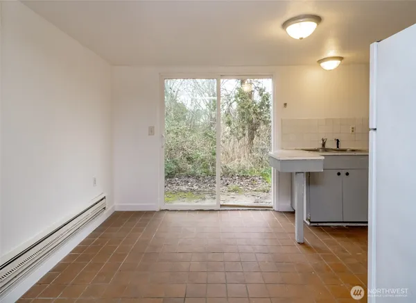 a view of room with window and bathroom