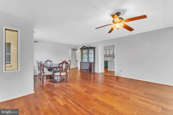 a view of a livingroom with furniture nad wooden floor