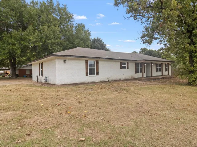 a house with trees in front of it