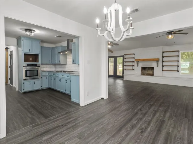 a view of a kitchen with a sink and dishwasher cabinets