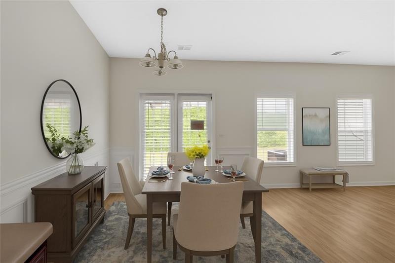 2555 Flat Shoals Road, Unit 1104 College Park, GA 30349 - Photo 14 of 33 a view of a dining room with furniture window and wooden floor