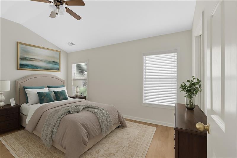 2555 Flat Shoals Road, Unit 1104 College Park, GA 30349 - Photo 17 of 33 a bedroom with a bed and a window