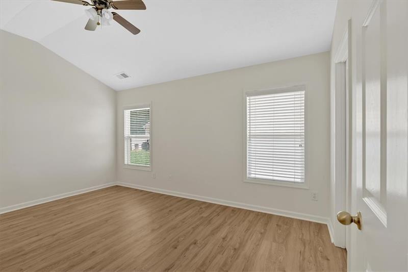 2555 Flat Shoals Road, Unit 1104 College Park, GA 30349 - Photo 18 of 33 a view of a room with a window and wooden floor