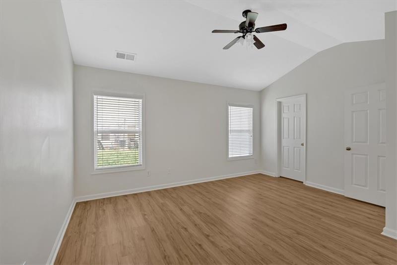 2555 Flat Shoals Road, Unit 1104 College Park, GA 30349 - Photo 20 of 33 wooden floor in an empty room with a window