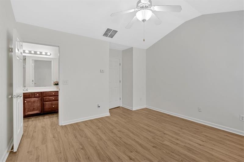2555 Flat Shoals Road, Unit 1104 College Park, GA 30349 - Photo 24 of 33 an empty room with wooden floor and cabinet
