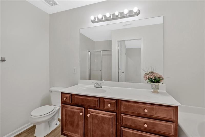 2555 Flat Shoals Road, Unit 1104 College Park, GA 30349 - Photo 26 of 33 a bathroom with a sink and a mirror