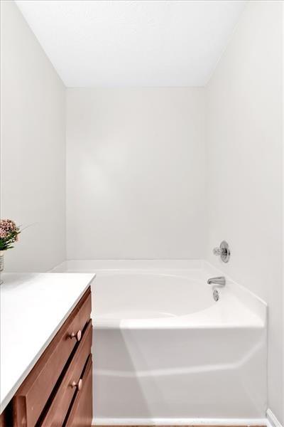 2555 Flat Shoals Road, Unit 1104 College Park, GA 30349 - Photo 28 of 33 a bathroom with a bathtub