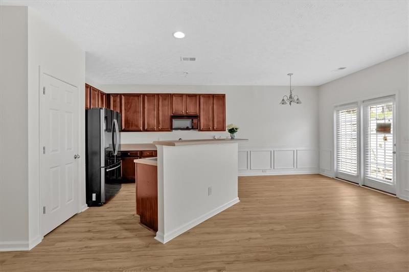 2555 Flat Shoals Road, Unit 1104 College Park, GA 30349 - Photo 6 of 33 a view of a kitchen with wooden floor
